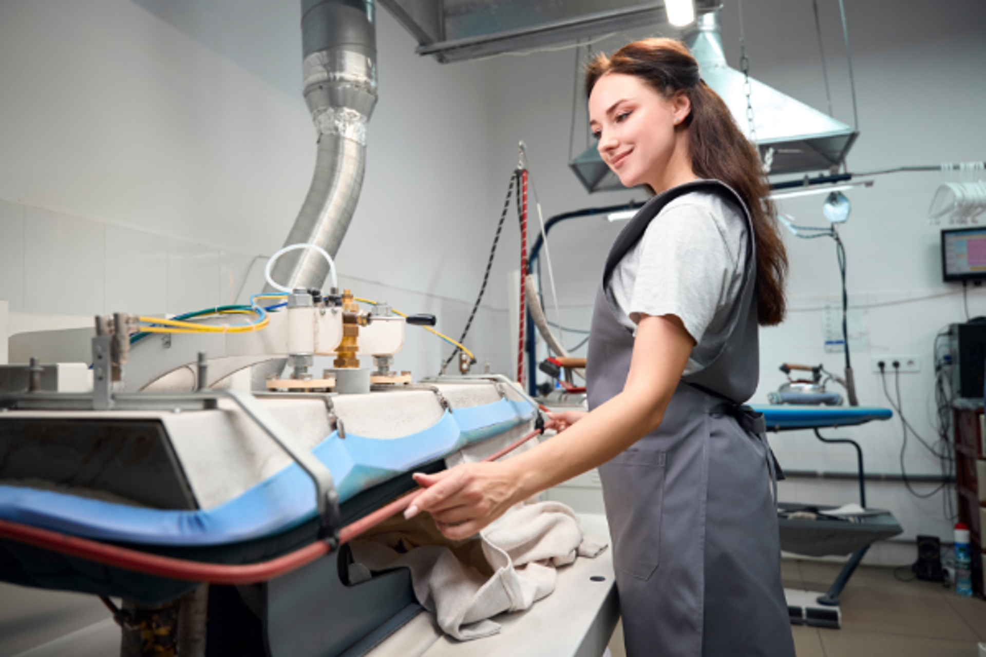 Worker At Dry Cleaning Steam Iron Press 600X400